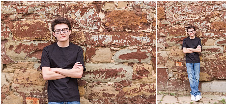 Guy leaning up against very rustic wall in fredericksburg ohio, photographed by Jamie Lynette Photography