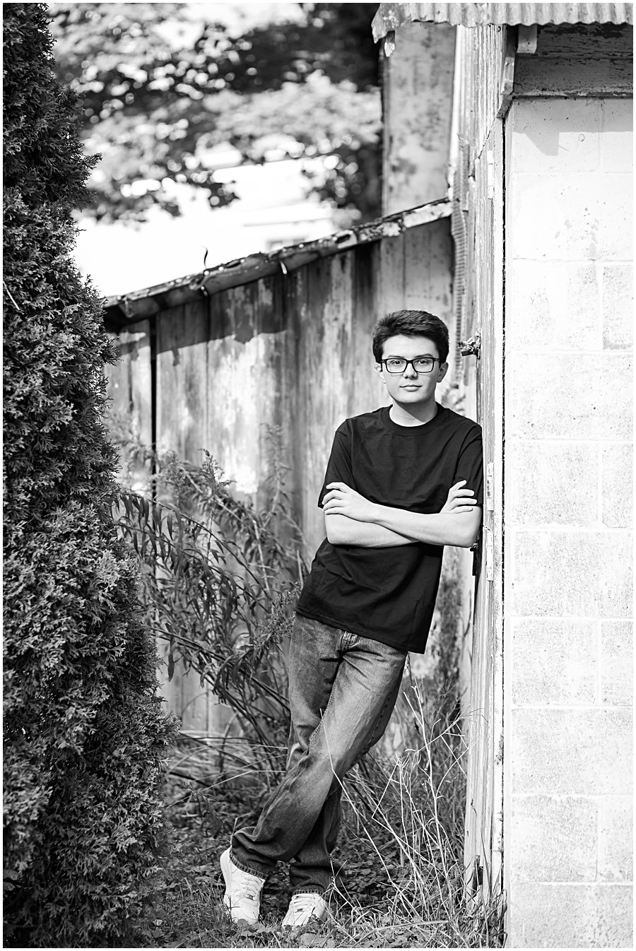 old white stone barn, senior guy leaning against, photographed by Jamie Lynette photography