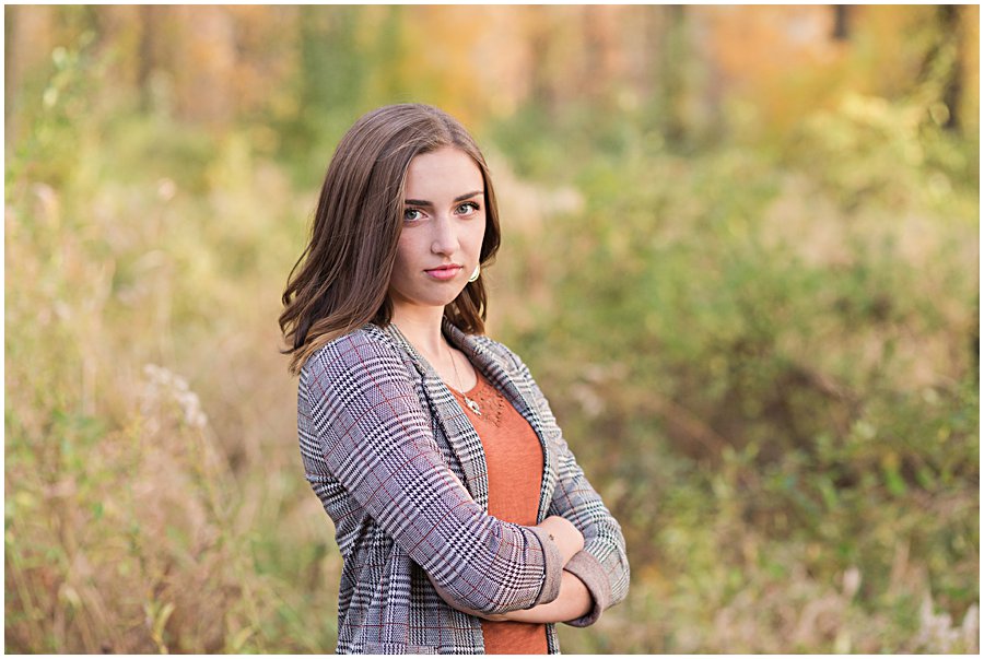 gorgeous waynedale high school female standing in field with fall color