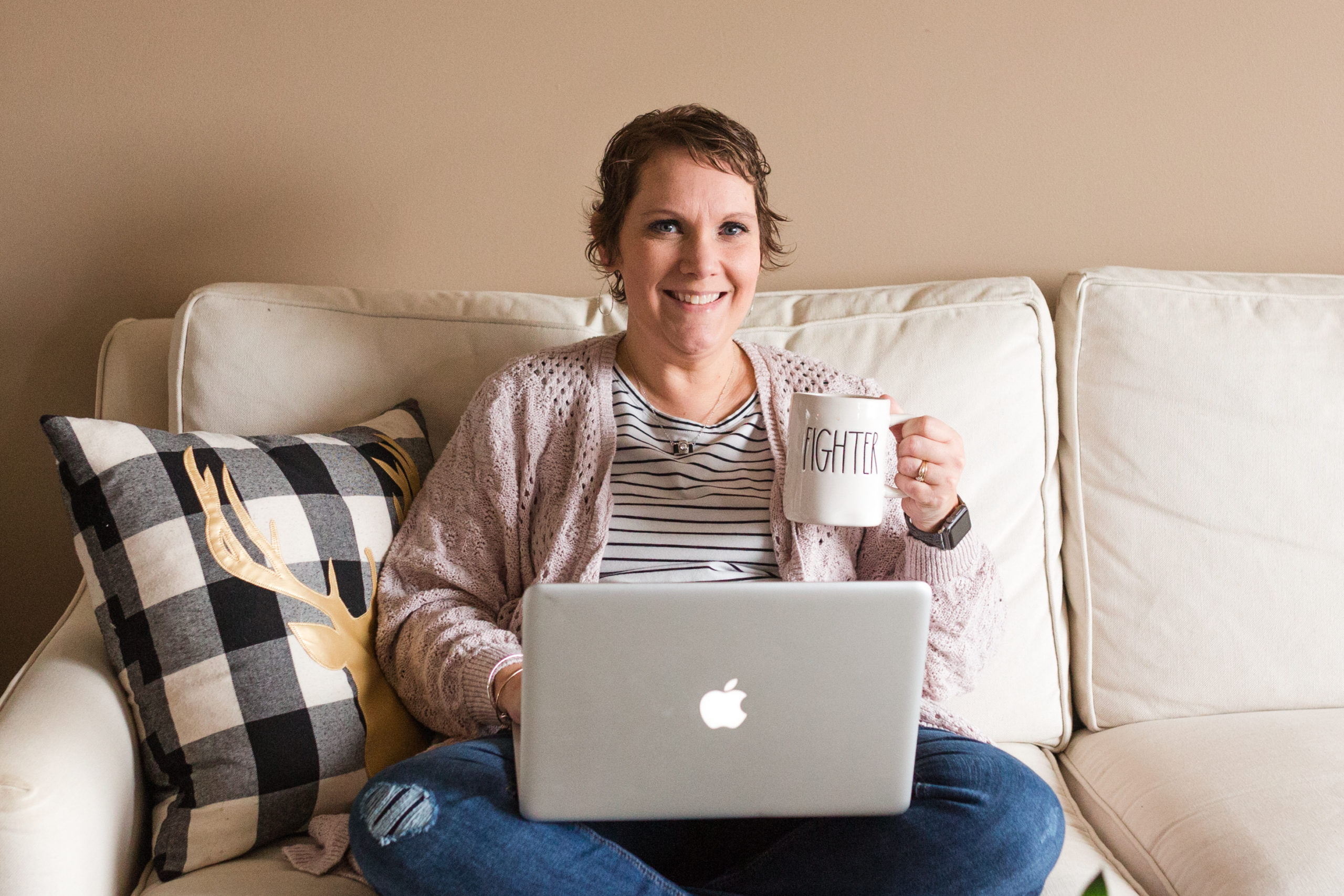 jamie lynette photography, sitting on couch with mac laptop and cup of coffee