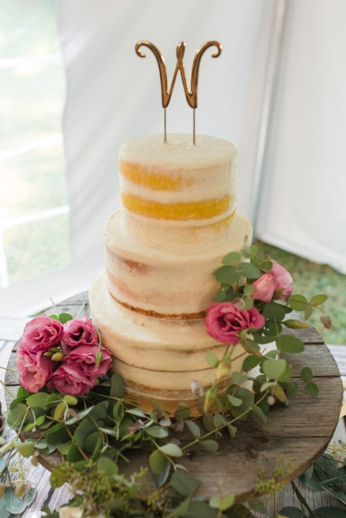 Tent reception with rustic decor at McKaylee and Tyler's intimate wedding