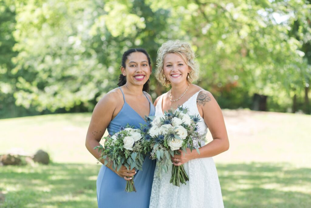 Bridesmaids wearing matching blue dresses for Wooster Ohio backyard wedding