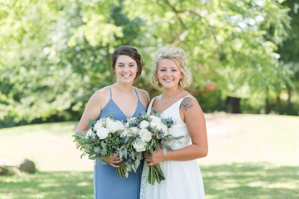 Bridesmaids wearing matching blue dresses for Wooster Ohio backyard wedding