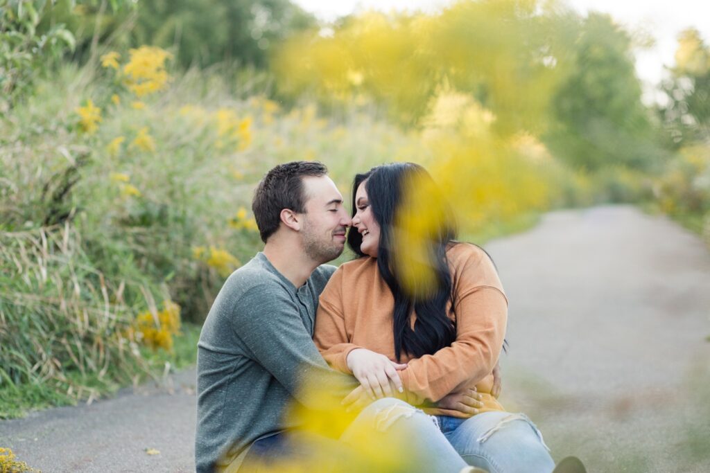 Kayla and Charlie smiling during their Barnes Preserve engagement session