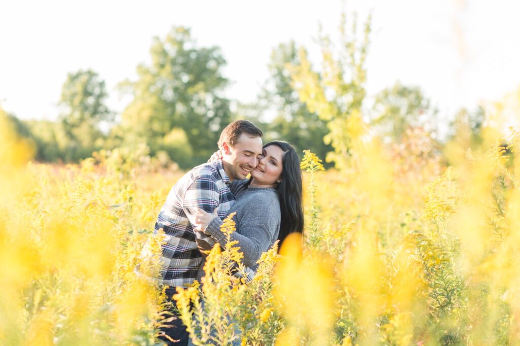 Kayla and Charlie snuggling during their Barnes Preserve engagement session