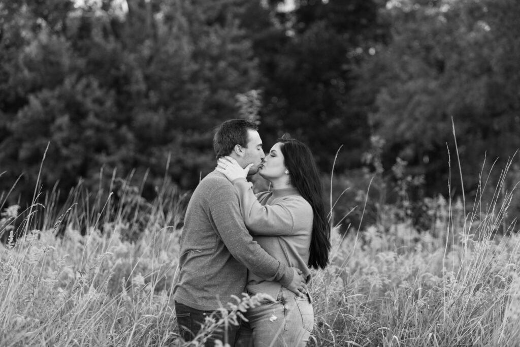 Kayla and Charlie smiling during their Barnes Preserve engagement session