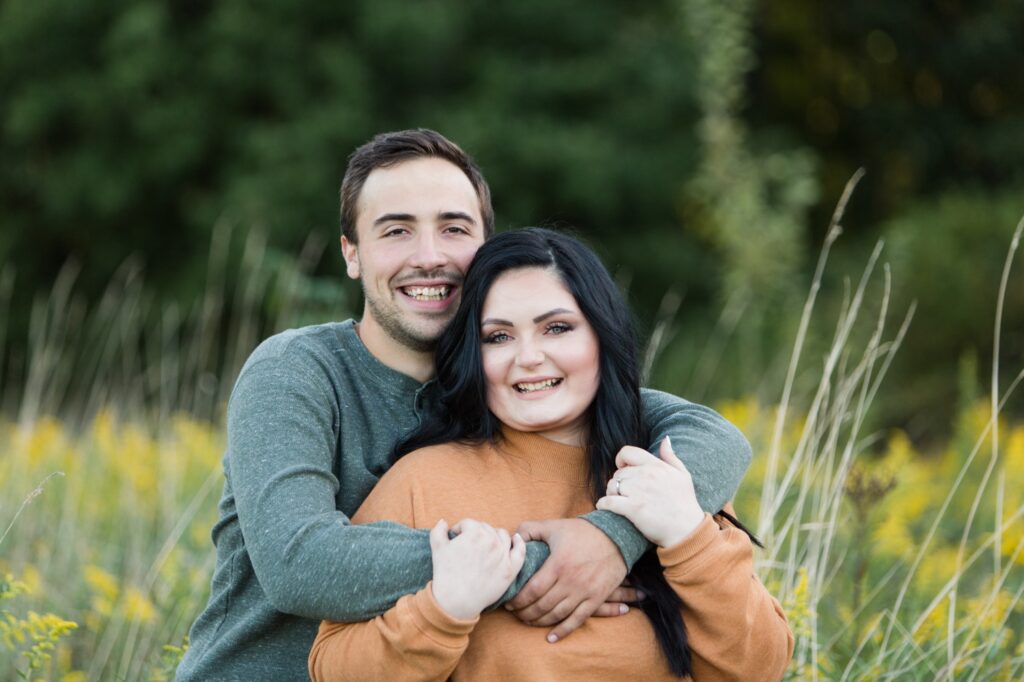 Kayla and Charlie smiling during their Barnes Preserve engagement session