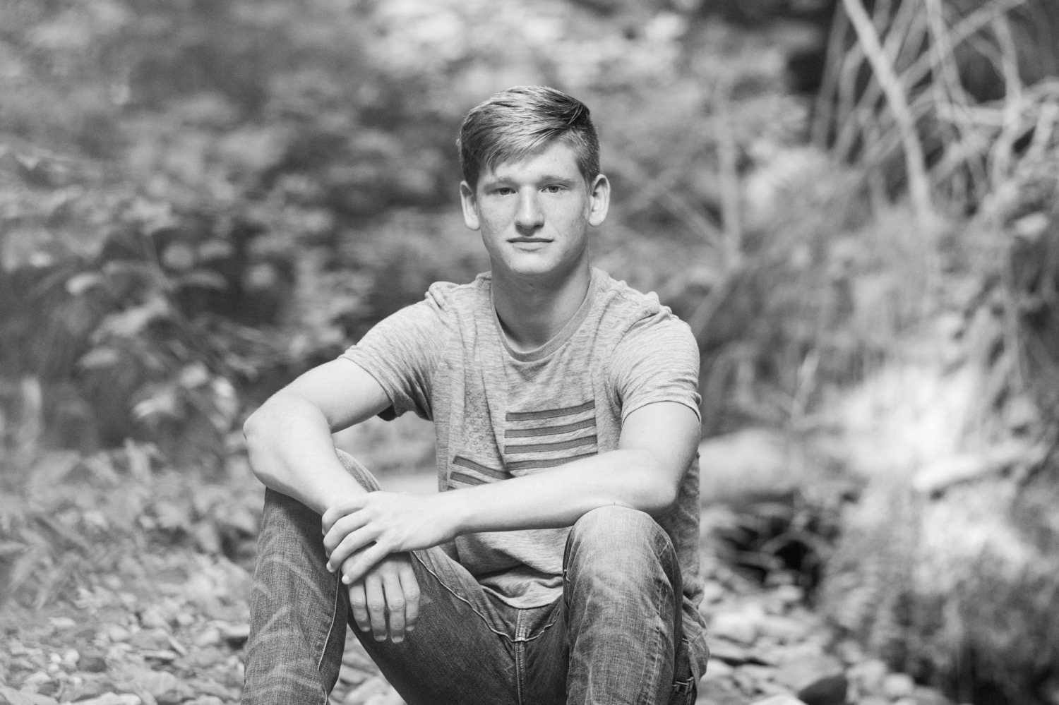 Senior boy sitting in woods, Rustic Country Senior Guy Photos
