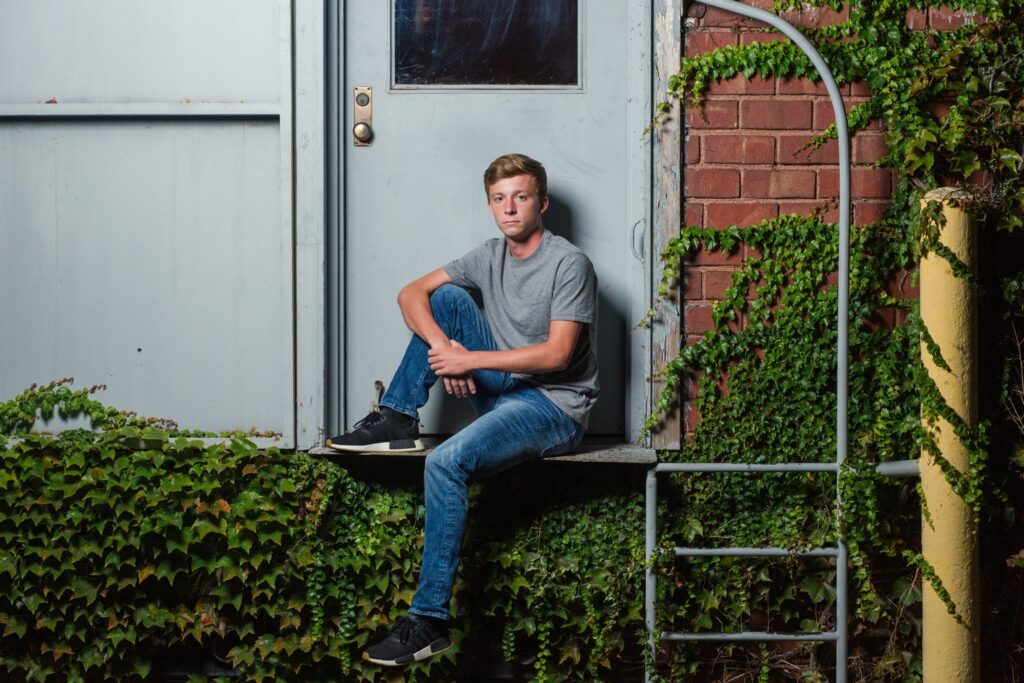 Urban senior photo in Wooster with dramatic lighting