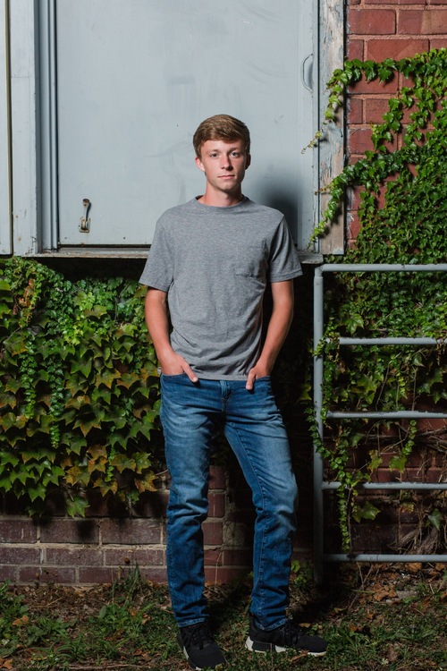 Urban senior photo in Wooster with dramatic lighting