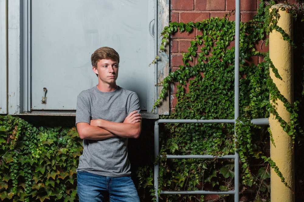 Urban senior photo in Wooster with dramatic lighting