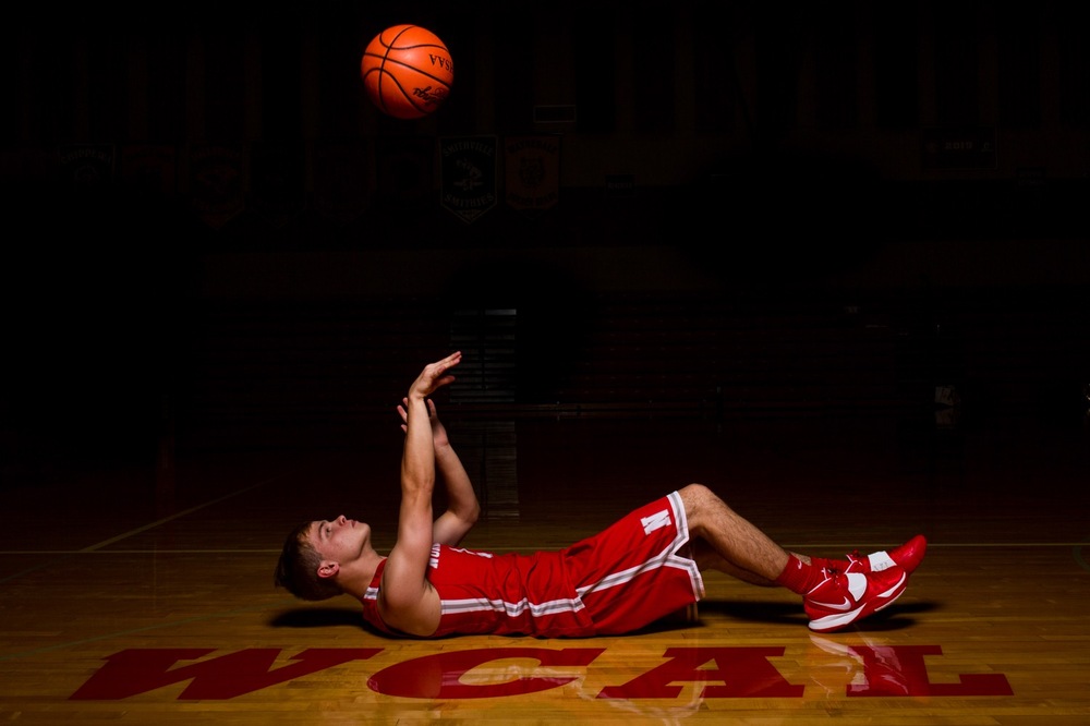 Basketball-themed senior photos in Norwayne gym