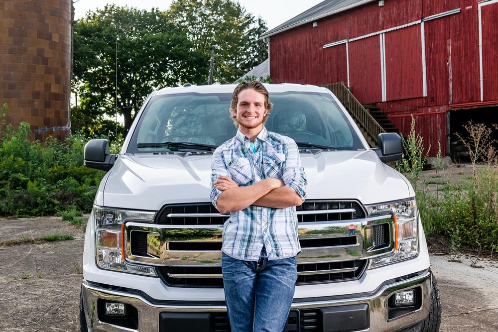 Jake’s senior photos at the barn with his truck