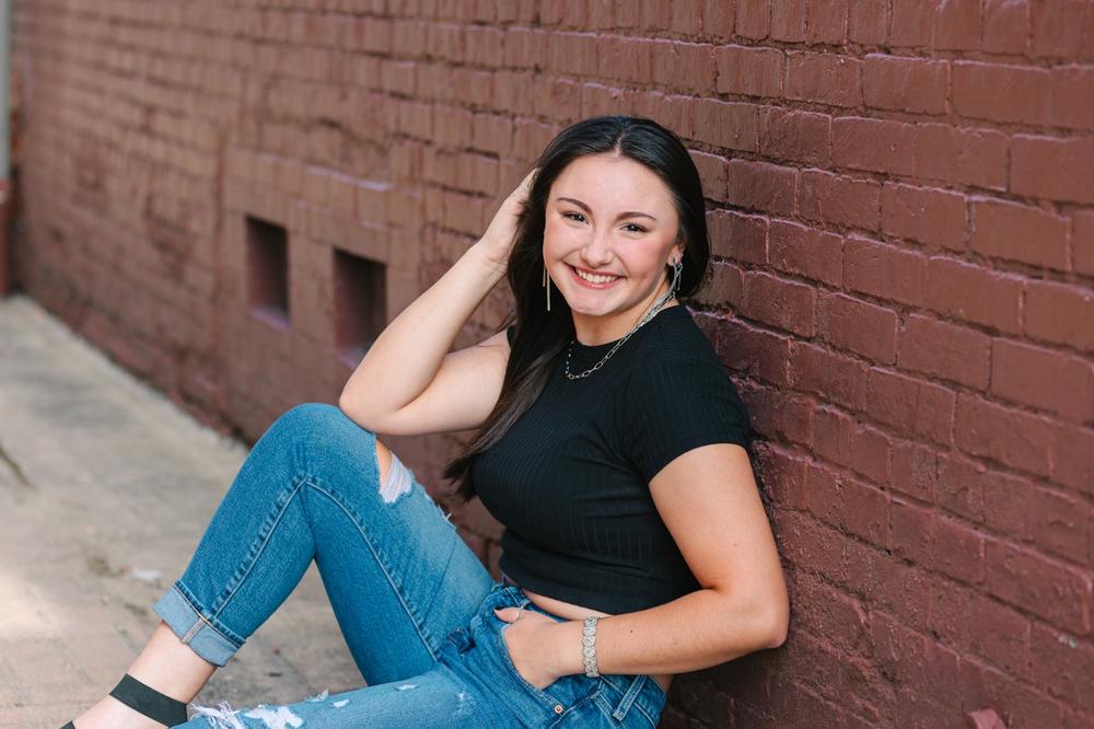 Urban senior pictures in Orrville Ohio with brick walls and textures