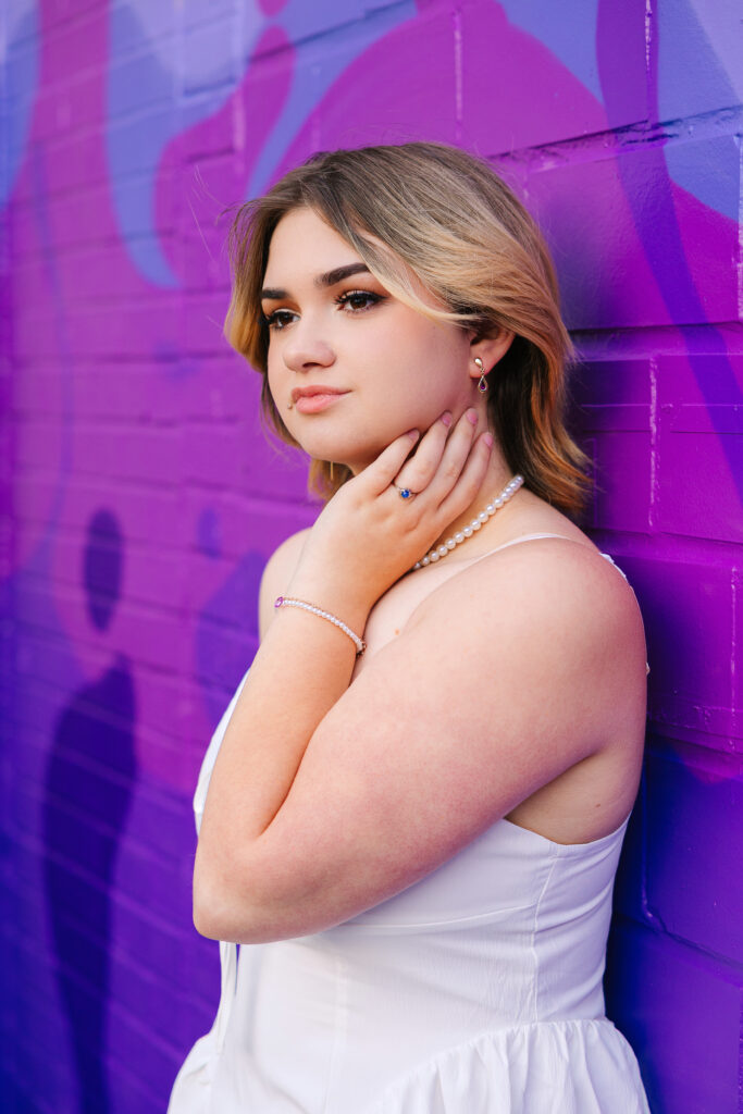 Senior photos in Canton Ohio in front of a vibrant, colorful mural