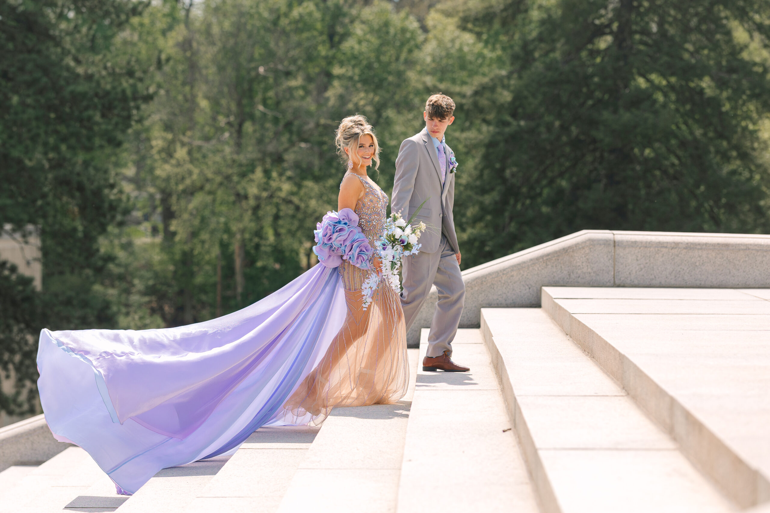 Pastel prom dress from Henri’s Cloud Nine flowing down the McKinley Monument steps in a photo by Canton Ohio photographer