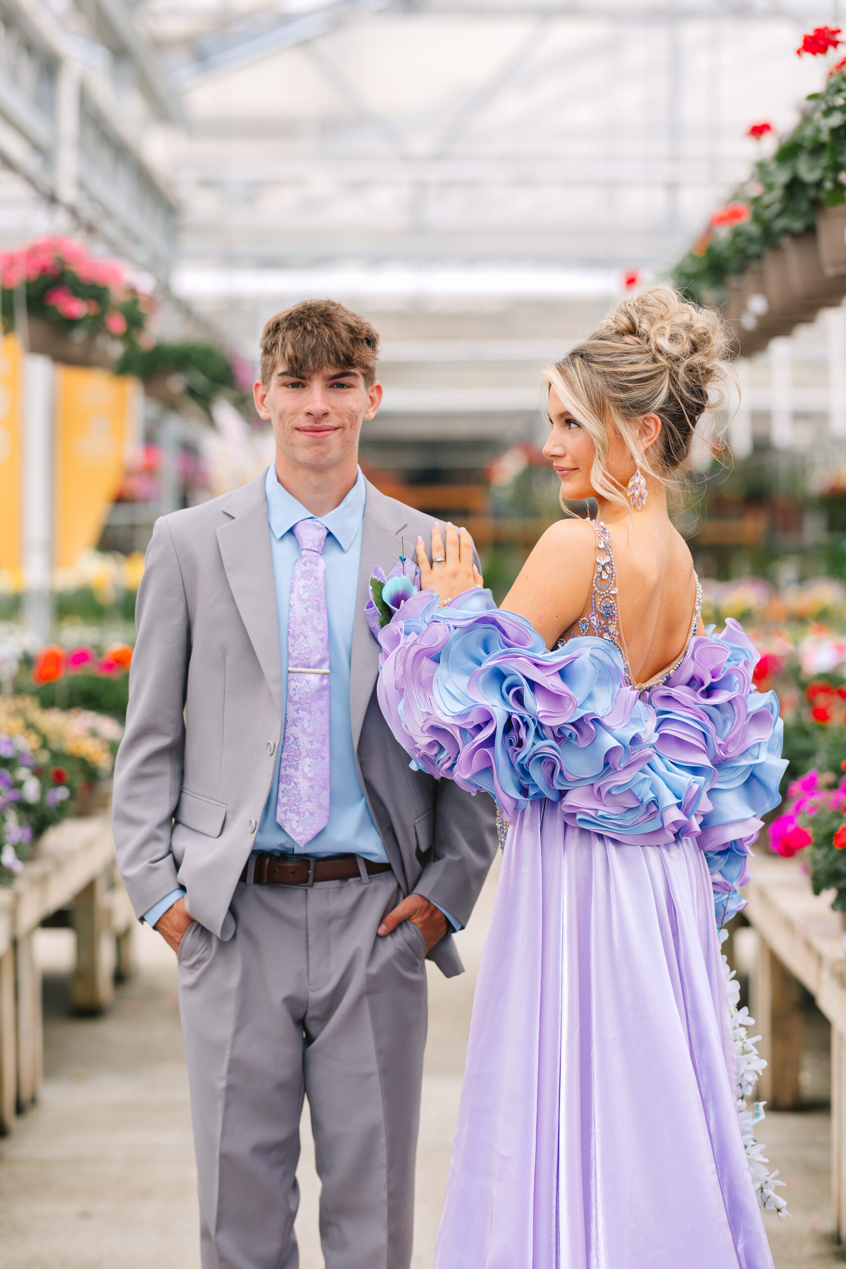 Charlee and Anthony surrounded by blooms during their prom photos at Petitti’s Garden Center